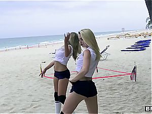 three teenage hotties catch a huge cumbot on the beach
